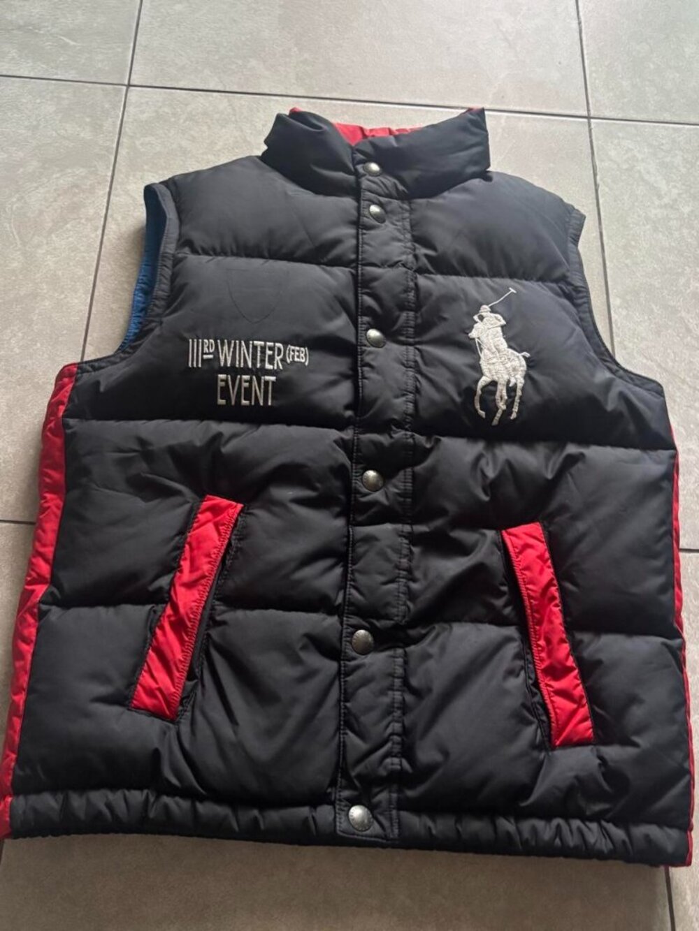 kids Polo Ralph Lauren black puffer vest with red side panels and white logo